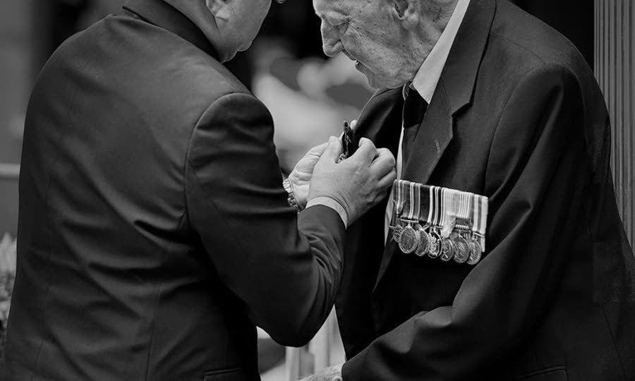 Elderly veteran being honored